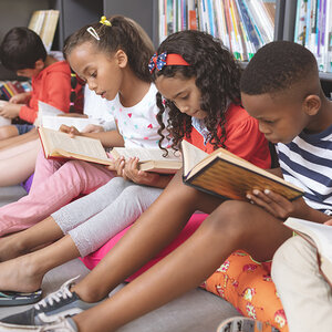 Children reading together. Children reading together.