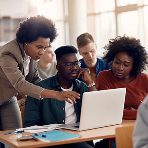 A professor helping a student online.