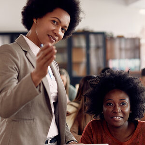 Two African American women in a classroom.