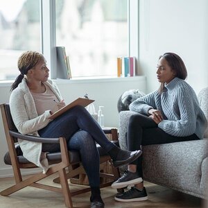 A therapist and patient having a conversation.