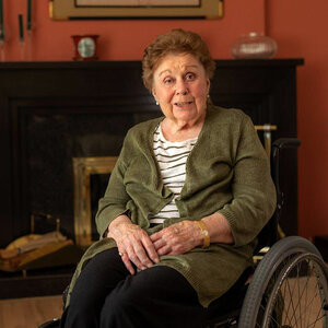 An image of a woman seated in a wheelchair–a photo of Karin Larson. An image of a woman seated in a wheelchair–a photo of Karin Larson.