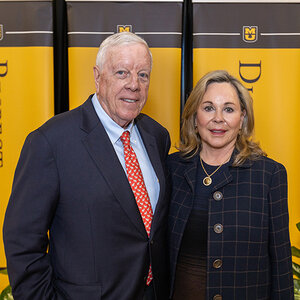 Giving Pledge signatories Rich and Nancy Kinder, standing together in front of University of Missouri branded walls. Giving Pledge signatories Rich and Nancy Kinder, standing together in front of University of Missouri branded walls.
