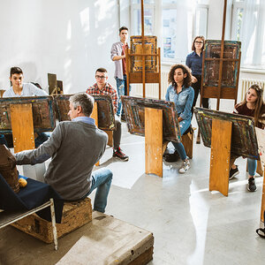 An art class gathered with their easels. An art class gathered with their easels.