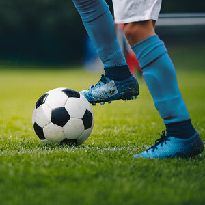 A soccer all on a field.