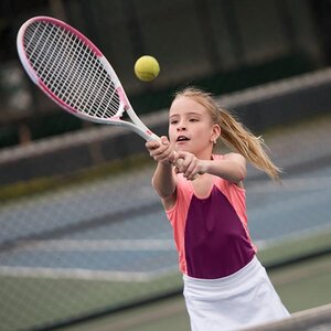 A child playing tennis.