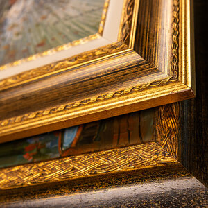 A stack of frames holding art. A stack of frames holding art.