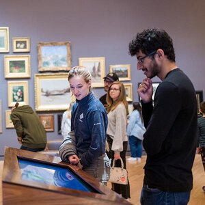 Museum-goers admiring an exhibit.