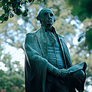 A bronze statue of George Washington on the campus of Washington College