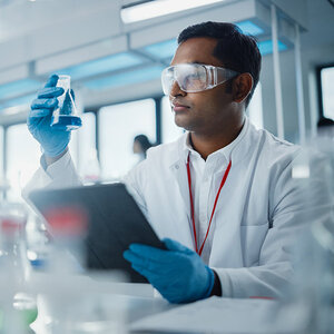 A researcher working in the lab. A researcher working in the lab.