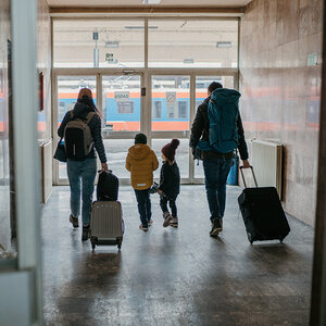 A family of asylum seekers leaving their home country. A family of asylum seekers leaving their home country.